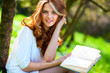 Young woman reading book