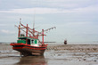 Fishing boat stuck on shore