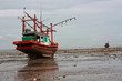 Fishing boat stuck on shore