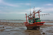 Fishing boat stuck on shore