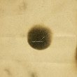 Burning spot on old paper.