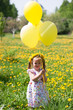 little girl on dandelion field