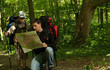 Father and son hiking in forest
