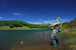 A fisherman fishing on a Mavrovo lake, Macedonia A fisherman fishing on a Mavrovo lake, Macedonia