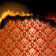 Piece of burning paper with floral pattern