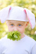 Child with bunny ears