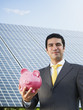 businessman and solar panels
