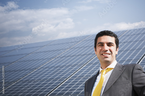 Photo: businessman and solar panels businessman and solar panels