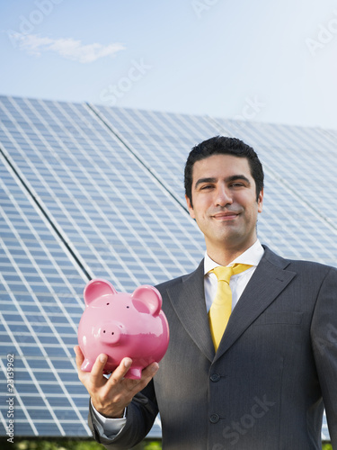 Photo: businessman and solar panels businessman and solar panels