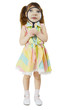 Little girl looks at you through large magnifying glass Little girl looks at you through large magnifying glass