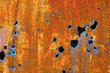 Old rusty sheet of iron with holes Old rusty sheet of iron with holes