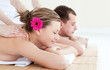 Relaxed young couple receiving a back massage
