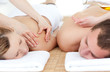 Relaxed couple receiving a back massage Relaxed couple receiving a back massage