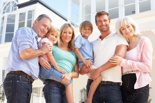 Photo: Extended Family Outside Modern House Extended Family Outside Modern House
