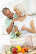 Photo: Senior Couple Preparing Salad In Modern Kitchen Senior Couple Preparing Salad In Modern Kitchen