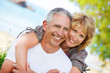 Close-up portrait of a mature couple smiling and embracing. Close-up portrait of a mature couple smiling and embracing.