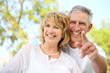 Close-up portrait of a mature couple smiling. Close-up portrait of a mature couple smiling.