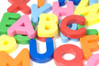 multicoloured bright plastic letters ABC on white background
