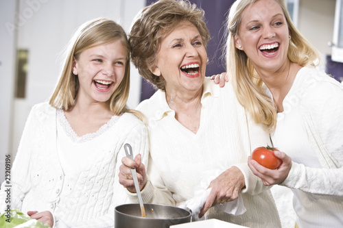 Photo: Grandmother with family laughing in kitchen Grandmother with family laughing in kitchen