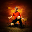 Football player in fires flame on the outdoors field Football player in fires flame on the outdoors field
