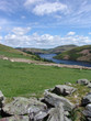 Welsh hills and lake with stone wall