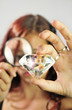 Girl Examining a Diamond Girl Examining a Diamond