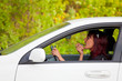 Woman in a car doing makeup. Woman in a car doing makeup.