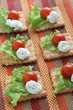 crackers with tomato and cream cheese