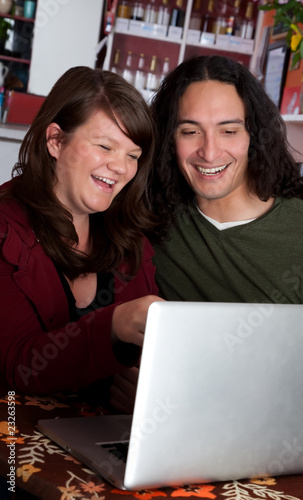 Photo: Couple with Laptop Laughing Couple with Laptop Laughing