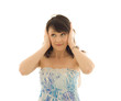 Pretty woman closing the ears with hands
