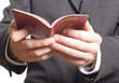 men's hand showing  passport in a customs control