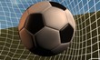 Balón de futbol contra red de porteria
