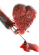 Spritze mit Blut und Herz aus Zucker