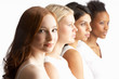 Portrait Of Four Attractive Young Women In Studio Standing In Li