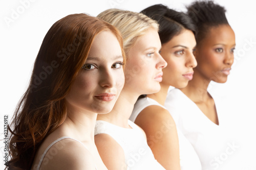 Photo: Portrait Of Four Attractive Young Women In Studio Standing In Li Portrait Of Four Attractive Young Women In Studio Standing In Li