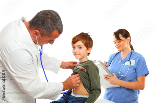 Photo: Male Doctor and female nurse examing a boy Male Doctor and female nurse examing a boy