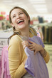 Woman Ecstatically Shopping for Clothes