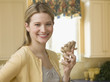 Woman Holding Ginseng in the Kitchen