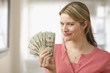 Woman Holding Cash