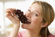 Woman Eating Grapes