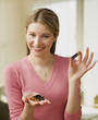 Young Woman Showing Batteries