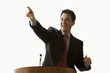 Businessman Smiling and Pointing - Isolated