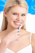 Young Woman Brushing Teeth In Studio