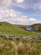 Dry stone wall in Welsh hills near lake