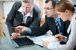 Business colleagues working on a laptop