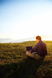 Photo: Freedom - Man using a laptop outdoors with copyspace Freedom - Man using a laptop outdoors with copyspace