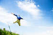 Photo: Businessman jumping on a green meadow with copyspace Businessman jumping on a green meadow with copyspace