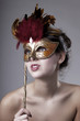 Beautiful girl with a carnival mask
