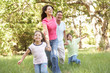 Family Enjoying Walk In Park