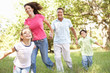 Family Enjoying Walk In Park